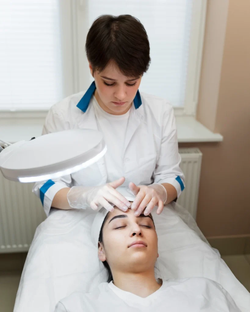 Dermatologist examining patient before biologic therapy for chronic skin disease in Calicut